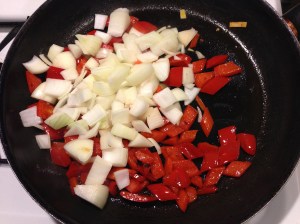 Onions get added to red peppers